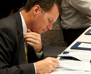 Brokers react to overvaluation report