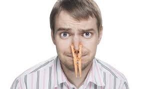 Worker wins fight over flatulence, foot-baths and foul language